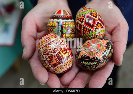 Collector Barbara Kruhoeffer presents colorfully painted eggs, which were designed with a special wax technique in Loccum, Germany,l 25 March 2013. Kruhoeffer's collection comprises about 5000 eggs from 70 regions of the world. Photo: Peter Steffen Stock Photo