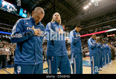 The Dallas Mavericks Jason Kidd (L) and Dirk Nowitzki (2nd from L) during the national anthem with the rest of the Mavericks before the Denver Nuggets game at the American Airlines Center in Dallas, Texas USA, 6 November, 2010. The Nuggets defeated the Mavericks 103 to 92. Photo: Ralph Lauer Stock Photo