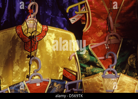 Traditional silk robes for sale in the market Beijing China Stock Photo