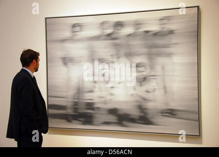 (FILE A file picture dated 07 November 2010 of man eyeing the painting 'Sailors' by German artist Gerhard Richter at Sotheby's in New York, NY, USA. Weserburg Museum had the work auctioned by Sotheby's on 09 November 2010, the work was auctioned at some 13.2 million US dollar (9.5 million euro). Photo: KIRA SEMMLER Stock Photo