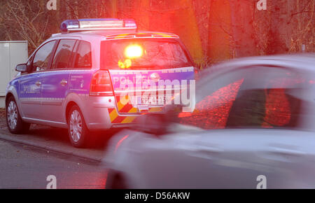 (FILE) - A picture dated 08 December 2009 shows a police car with radar equipment taking a picture of a car passing by during a speed monitoring in Schifferstadt, Germany. According to several newspaper reports on 10 November 2010, a judge in Herford absolved 40 monitored drivers, because he thinks speed traps are a rip-off. Judge Koerner demanded clearer laws concerning the speed  Stock Photo