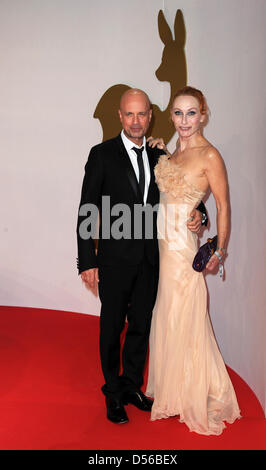 German actors Christian Berkel and his wife Andrea Sawatzki arrive for the Bambi award in Potsdam, Germany, 11 November 2010. The Bambis are the main German media awards and are presented for the 62nd time. Photo: Jens Kalaene Stock Photo