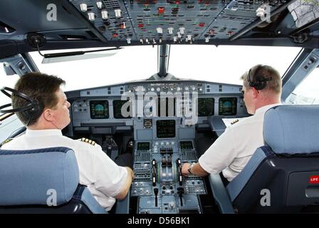 (file) - A dpa file picture dated 17 July 2003 shows LTU pilots in the cockpit of an Airbus A321-200 in Hamburg, Germany. After problems with the engine used in Airbus A380 aircrafts, Airbus CEO Thomas Enders expects delays in the delivery of the superplane to customers. This is due to Rolls-Royce's advise to check the engines more thoroughly and to exchange certain parts of the Tr Stock Photo