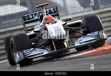 German driver Michael Schumacher Mercedes GP during Qualfying session at Yas Marina Circuit race track in Abu Dhabi, United Arab Emirates, 13 November 2010. Germany's Vettel of Red Bull claimed pole position ahead of Britain's Hamilton of McLaren Mercedes and Spain's Alonso of Scuderia Ferrari. The title-decisive 2010 Formula One season finale will be held on 14 November at Yas Mar Stock Photo