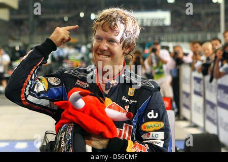 The 2010 Formula One World Champion, Germany's Sebastian Vettel of Red Bull Racing at Yas Marina Circuit in Abu Dhabi, United Arab Emirates, 14 November 2010. Winning the Formula 1 Abu Dhabi Grand Prix, Vettel clinched the title and becomes the youngest-ever world champion. Photo: Jens Buettner Stock Photo