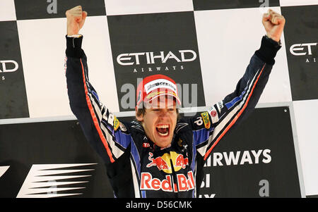 The 2010 Formula One World Champion, Germany's Sebastian Vettel of Red Bull Racing at Yas Marina Circuit in Abu Dhabi, United Arab Emirates, 14 November 2010. Winning the Formula 1 Abu Dhabi Grand Prix, Vettel clinched the title and becomes the youngest-ever world champion. Photo: Jens Buettner Stock Photo