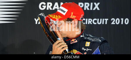 The 2010 Formula One World Champion, Germany's Sebastian Vettel of Red Bull Racing at Yas Marina Circuit in Abu Dhabi, United Arab Emirates, 14 November 2010. Winning the Formula 1 Abu Dhabi Grand Prix, Vettel clinched the title and becomes the youngest-ever world champion. Photo: Jens Buettner Stock Photo