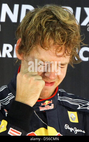 The 2010 Formula One World Champion, Germany's Sebastian Vettel of Red Bull Racing at Yas Marina Circuit in Abu Dhabi, United Arab Emirates, 14 November 2010. Winning the Formula 1 Abu Dhabi Grand Prix, Vettel clinched the title and becomes the youngest-ever world champion. Photo: Jens Buettner Stock Photo