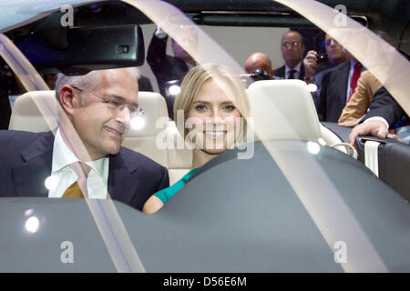A handout picture released by Volkswagen shows German top model Heidi Klum (R) and Jonathan Browning (L),pPresident and CEO of Volkswagen Group of America sitting in front seats of the new VW Eos Cabrio-Coupé during the L.A. Auto Show at the Convention Center in Los Angeles, United States, 17 November 2010. VW celebrates the world premiere of the new Eos Cabrio-Coupé at the automob Stock Photo