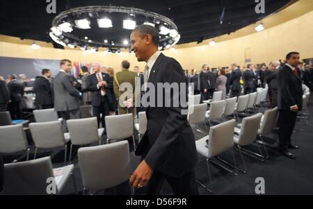 US president Barack Obama walks to his seat before another session at the NATO summit conference in Lisbon, Portugal, 20 November 2010. About 50 heads of states are expected to attend the two-day-long summit meeting. Main topics that will be discussed are a European co-operation for the assembling of a common antimissile defence in Europe as well as further steps in Afghanistan. To Stock Photo