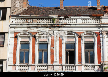 Vidin, Bulgaria - old apartment building. Windows close-up. Stock Photo