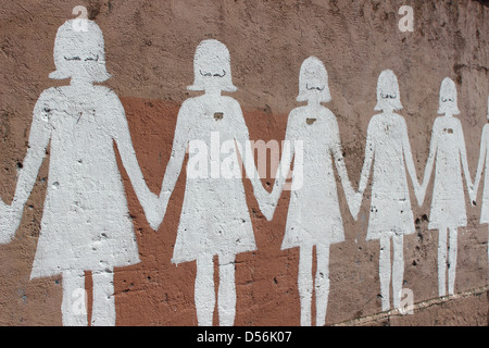 Paper doll graffiti in a public street - Rome Stock Photo