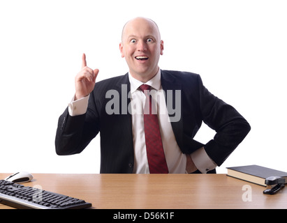businessman sat at desk with a great idea or plan, isolated on white background Stock Photo