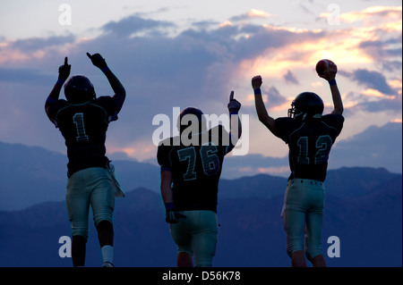 Football players cheering in game Stock Photo