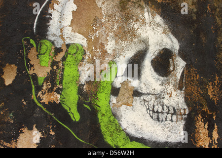 painted graffiti in a wall of rome - Skull Stock Photo