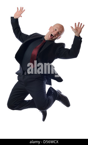 Full length of business man jumping in joy on white background Stock Photo