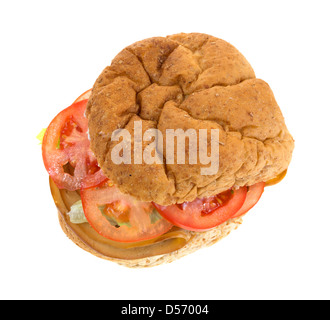 A sandwich made of smoked tofu turkey with lettuce and tomatoes on a whole wheat bulky roll. Stock Photo
