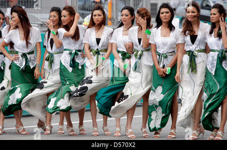 Grid girls pictured prior to the Formula One Grand Prix of Malaysia at Sepang racetrack near Kuala Lumpur, Malaysia, 04 April 2010. Photo: JENS BUETTNER Stock Photo