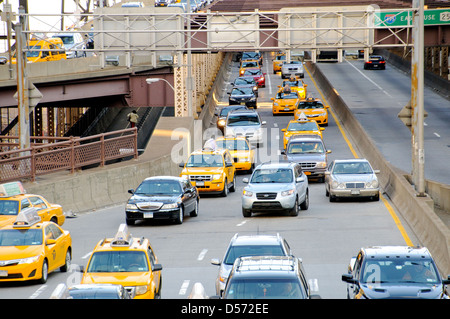 Traffic exiting Queensboro 59th Street Bridge during evening rush hour, Midtown Manhattan, New York City, USA Stock Photo