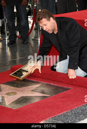 Australian actor Russell Crowe receives the 2,404th star on the Hollywood Walk of Fame in Hollywood, California, USA, 12 April 2010. Crowe, a three-time consecutive Academy Award Best Actor nominee, took home the Oscar for his performance in ''Gladiator''. Photo: Hubert Boesl Stock Photo