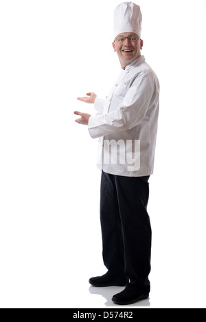 Male chef smiling pointing to a product isolated on white Stock Photo