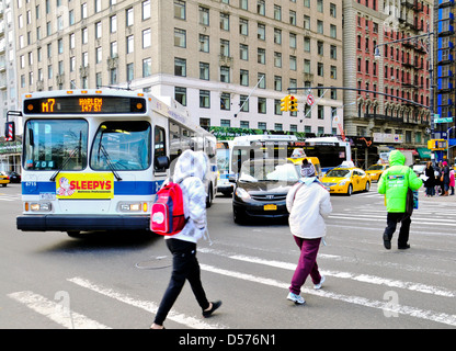 MTA M7 public transportation bus, six avenue Central Park South, Midtown Manhattan, New York City Stock Photo