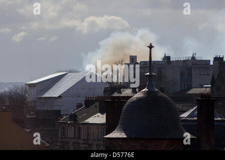 Glasgow, Scotland, UK. 26th March, 2013. Glasgow Steiner School has been on fire since around 11:30am and firefighters are still tackling the blaze. Smoke can be seen rising from the fire covering Glasgow's West End Credit: Paul Stewart/Alamy Live News Stock Photo