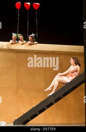 Soprano singer Ilia Papandreou (R), starring as 'Nana', and Susanne Langbein (above L-r), Franziska Kroetenheerdt, and Stephanie Johnson rehearse for the opera 'Nana' by Manfred Gurlitt at the Erfurt Theatre, Germany, 22 April 2010. The opera tells the story of Nana who tries to escape from the lower class to become a part of the Parisian upper class. Gurlitt's opera is based on th Stock Photo