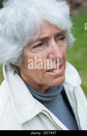 Senior woman looking away in thought, portrait Stock Photo