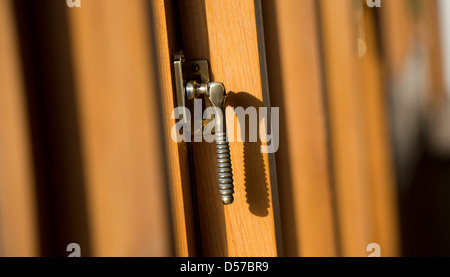 Close up of ornate latch on a domestic window. Stock Photo
