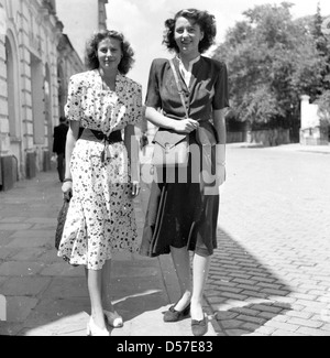 Bulgaria, 1950s. Historical picture of two young well dressed women walking in the town. Stock Photo