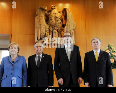 German Chancellor Angela Merkel (L-R), Hans-Juergen Papier, former President of the Federal Constitutional Court of Germany (Bundesverfassungsgericht - BVerfG), Papier's successor Andreas Vosskuhle and Horst Koehler, Federal President of Germany, stand in the Federal Constitutional Court in Karlsruhe, Germany, 14 May 2010. Vosskuhle was formally inaugurated in a ceremonial act duri Stock Photo