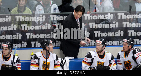 Germany's head coach Uwe Krupp (C) during 2010 IIHF World Championship's group E match Russia vs Germany in Cologne, Germany, 15 May 2010. Photo: ROLF VENNENBERND (EDITORIAL USE ONLY) Stock Photo