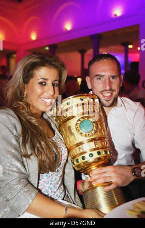 Franck Ribery and his wife Wahiba Ribery pose with the DFB-Trophy Stock