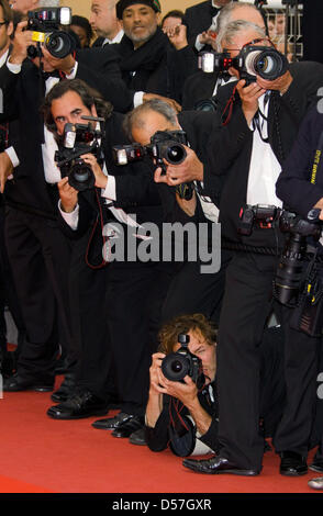 Photographers work at the premiere of 'You Will Meet A Tall Dark Stranger' at the Cannes Film Festival in Cannes, France, 15 May 2010. Photo: Hubert Boesl Stock Photo