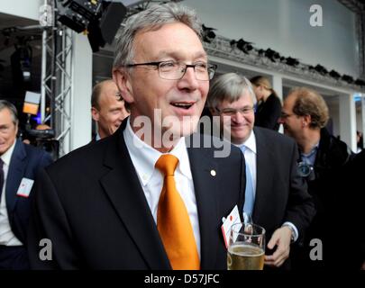 Lufthansa CEO Wolfgang Mayrhuber is happy about the distribution of the first A380 airplane of Lufthansa at the Airbus location in Hamburg, Germany, 19 May 2010. The Airbus A380 is called 'Frankfurt am Main', is 72 metres long and can host 526 passengers. The Lufthansa airplane will fly to Frankfurt Main with selected guests during the early afternoon to continue the celebrations.  Stock Photo