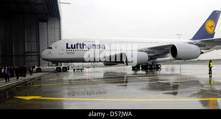 The first Airbus A380 of German carrier Lufthansa arrives at the airport of Frankfurt Main, Germany, 19 May 2010. The Airbus A380 was baptised on the name 'Frankfurt am Main', is 72 metres long, 15,000 kilometres range and can host up to 853 passengers. Lufthansa's new airplane will fly to Frankfurt Main with selected guests during the early afternoon to continue the celebrations,  Stock Photo