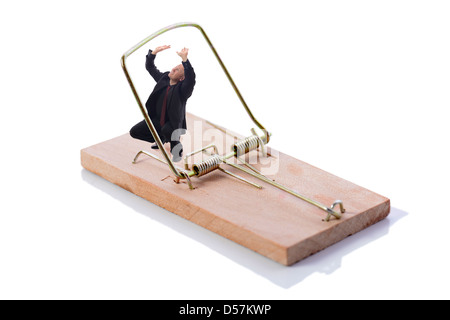 Businessman caught in a trap isolated on white Stock Photo