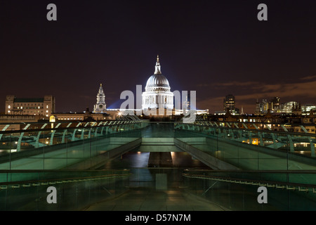 A view of a floodlit St. Paul's Cathedral from the South end of the Millennium Bridge in Bankside, London.