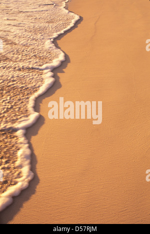 detail of waves washing up on beach Stock Photo