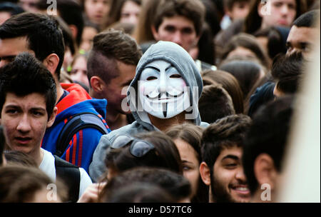 Nicosia, Cyprus. 26th March, 2013. A man wearing a Guy Fawkes mask is seen amang Cypriot students during an organised rally in Nicosia, Cyprus, 26 March 2013 in protest against the island's financial bailout conditions and knock on effects. Foto: Iakovos Hatyistavrou/dpa/Alamy Live News Stock Photo