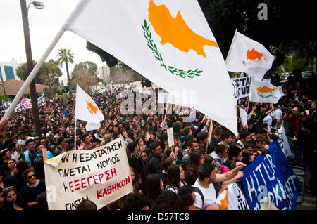 Nicosia, Cyprus. 26th March, 2013. Cypriot students raise banners and shout slogans during an organised rally in Nicosia, Cyprus, 26 March 2013 in protest against the island's financial bailout conditions and knock on effects. Foto: Iakovos Hatyistavrou/dpa/Alamy Live News Stock Photo