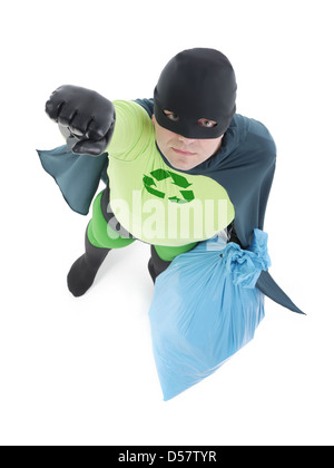 Eco superhero holding blue plastic bag full of domestic trash pointing his hand up standing on white background Stock Photo