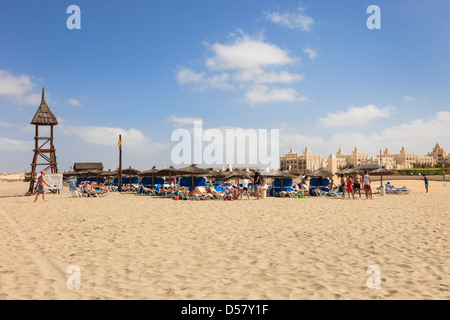 Sunbeds and sunbathers in Riu Karamboa beach resort hotel on Praia de Salinas, Rabil, Boa Vista, Cape Verde Islands Stock Photo