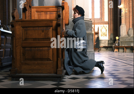 A woman praying in Cathedral Basilica of the Assumption of the Blessed Virgin Mary in Bialystok  Poland Stock Photo