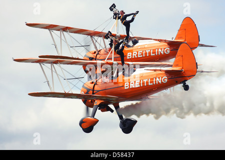 Breitling Wingwalkers British aerobatics and wingwalking team performing at Farnborough Airshow 2012, UK Stock Photo