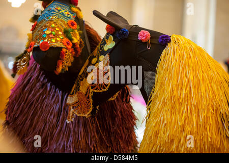 New York, USA. 26th March, 2013. Dancers in 30 colorful horse costumes perform 'Heard-NY' by performance artist Nick Cave and choreographer William Gill in Vanderbilt Hall of Grand Central Terminal in New York on Tuesday, March 26, 2013. The costumes made of fabric are each inhabited by two dancers from the Alvin Ailey School who meander around the hall like a herd of horses. Cave is known for his 'soundsuits', costumes which are sculptures that make noise as the wearer moves about. The performances are twice a day at 11AM and 2PM until March 31. Credit:  Richard B. Levine/Alamy Live News) Stock Photo