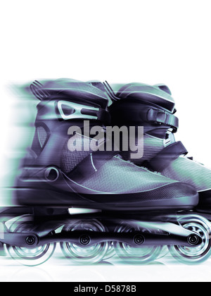 Closeup of inline skates, rollerblades artistic dynamic still life with motion blur isolated on white background Stock Photo
