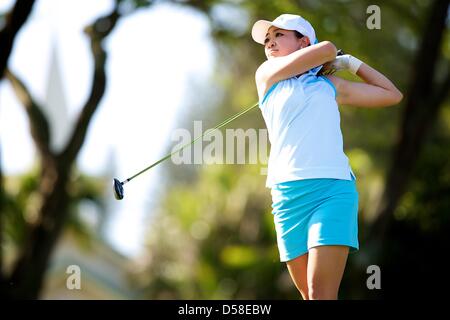 Kapalua, Hawaii, USA. 25th March 2013. Tiffany Lua of UCLA takes a swing during the 2013 Anuenue Spring Break Classic hosted by University of Hawaii at the Kapalua Bay Course on the island of Maui. Credit: Cal Sport Media / Alamy Live News Stock Photo
