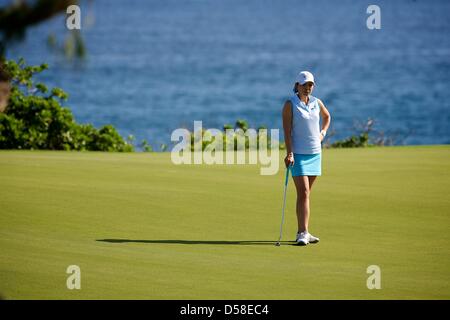 Kapalua, Hawaii, USA. 25th March 2013. Tiffany Lua of UCLA waits to putt during the 2013 Anuenue Spring Break Classic hosted by University of Hawaii at the Kapalua Bay Course on the island of Maui. Credit: Cal Sport Media / Alamy Live News Stock Photo